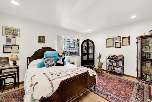 bedroom with wood-type flooring