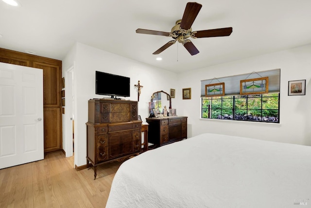 bedroom featuring ceiling fan and light wood-type flooring