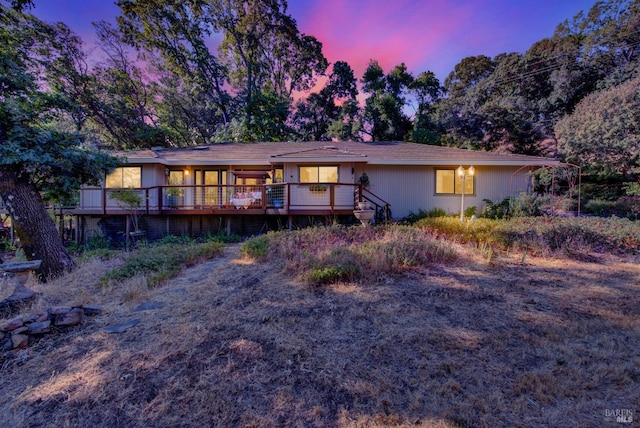 view of front of house featuring a wooden deck