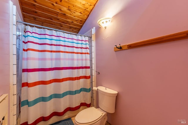 bathroom featuring toilet, a shower with shower curtain, lofted ceiling, and wood ceiling