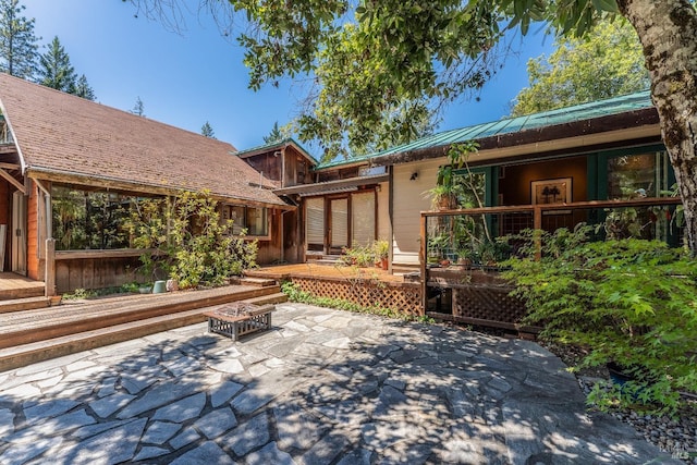 view of patio / terrace with a fire pit