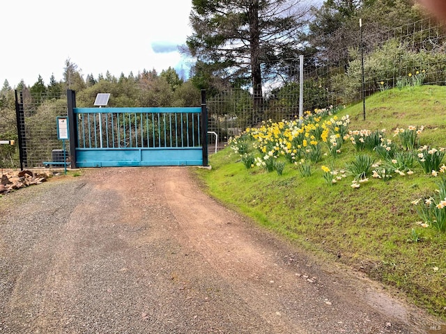 view of gate featuring fence