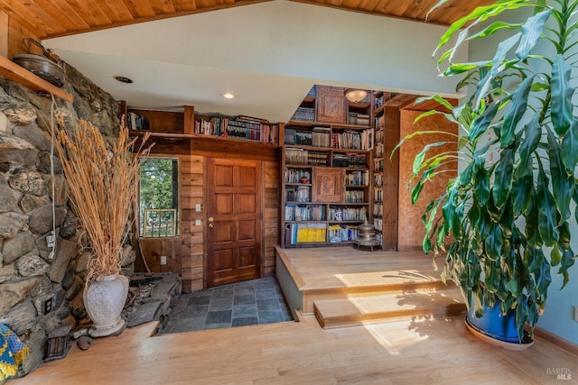 entrance foyer with vaulted ceiling and wood finished floors