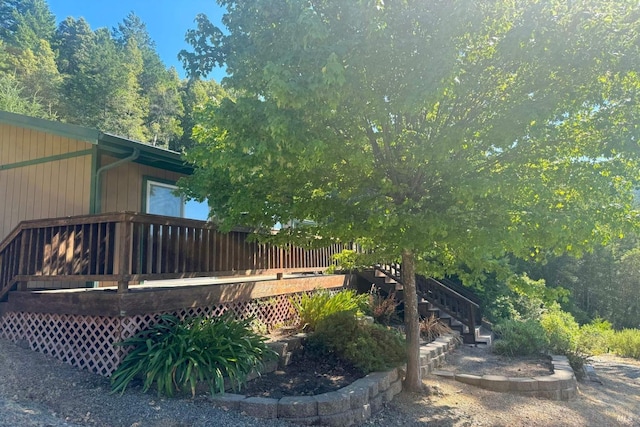 view of yard with a wooden deck