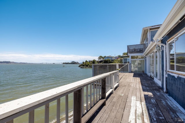 wooden terrace with a water view