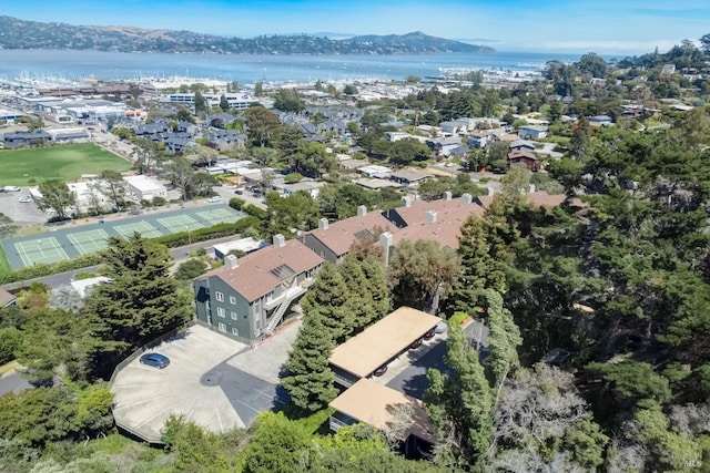 birds eye view of property with a water and mountain view