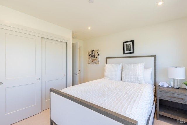 carpeted bedroom with a closet