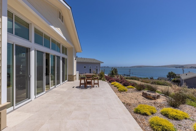 view of patio / terrace featuring a water view