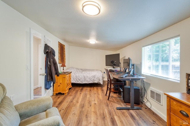 bedroom with light hardwood / wood-style floors