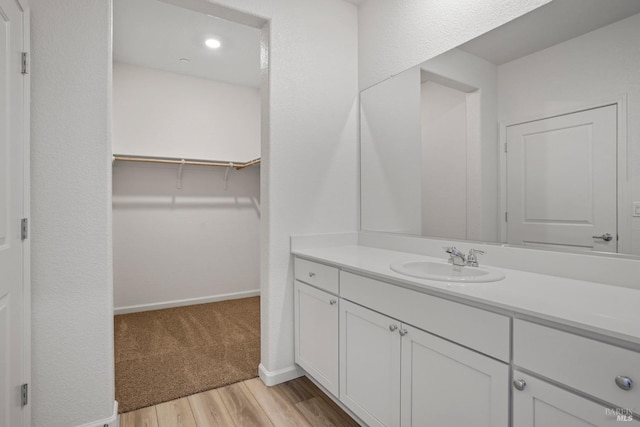 bathroom with wood-type flooring and vanity