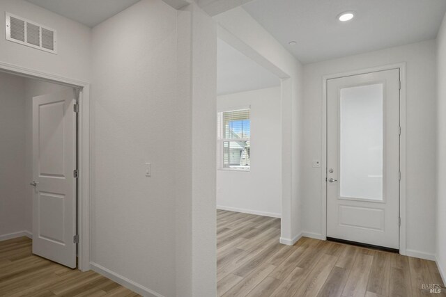 hallway featuring light hardwood / wood-style flooring