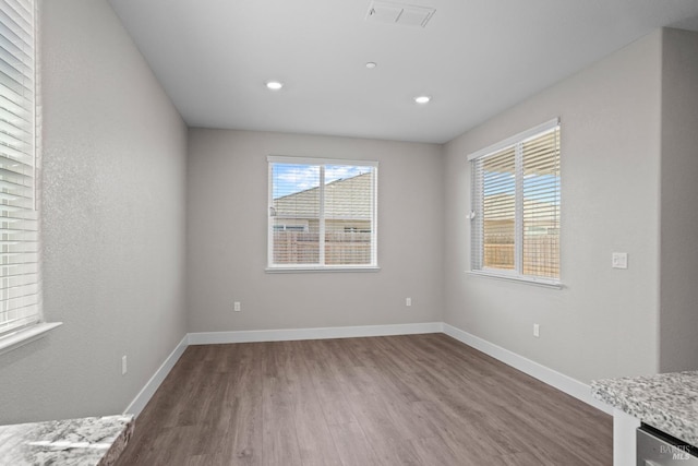 empty room with hardwood / wood-style flooring