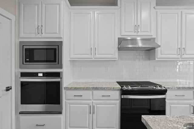 kitchen featuring appliances with stainless steel finishes, tasteful backsplash, ventilation hood, light stone countertops, and white cabinets