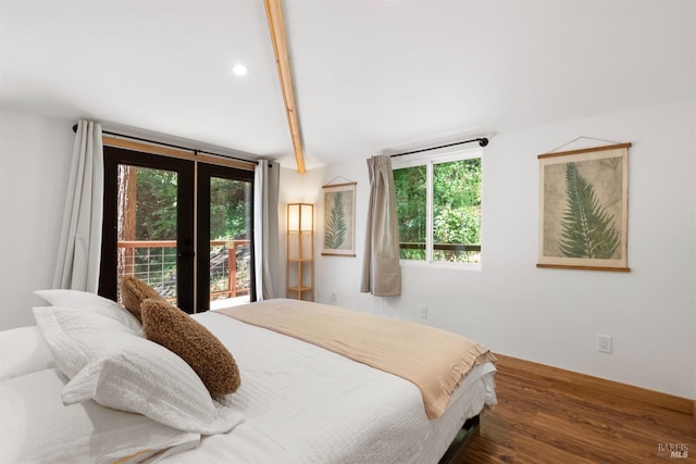 bedroom with dark hardwood / wood-style floors, beam ceiling, access to exterior, and french doors