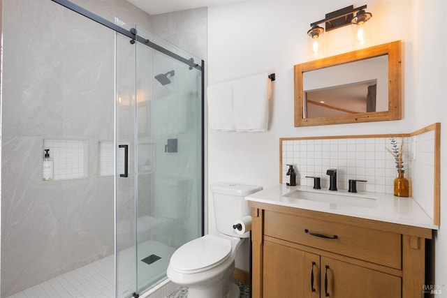 bathroom with tasteful backsplash, toilet, and walk in shower