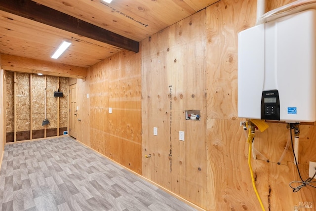 interior space featuring water heater, wooden ceiling, light wood-type flooring, and wood walls