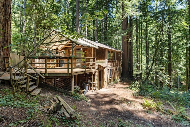 rear view of house with a deck