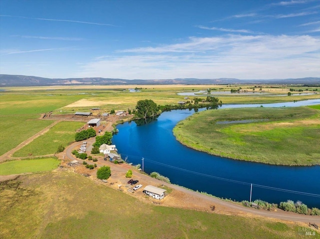 birds eye view of property featuring a mountain view and a rural view