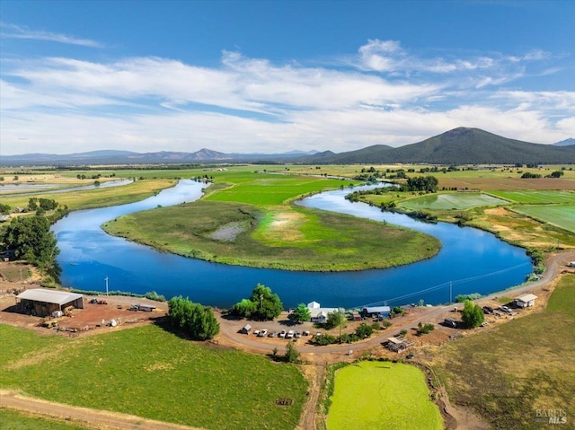 surrounding community with a water and mountain view and a rural view