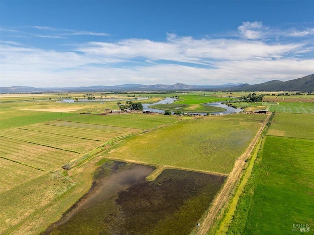 aerial view featuring a rural view and a water and mountain view