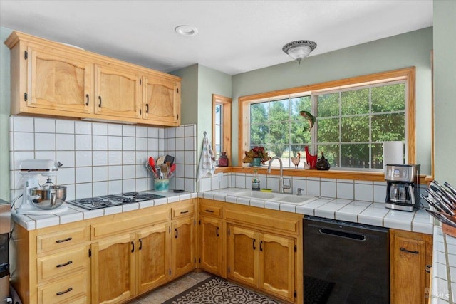 kitchen featuring decorative backsplash, sink, dishwasher, tile countertops, and light tile patterned floors