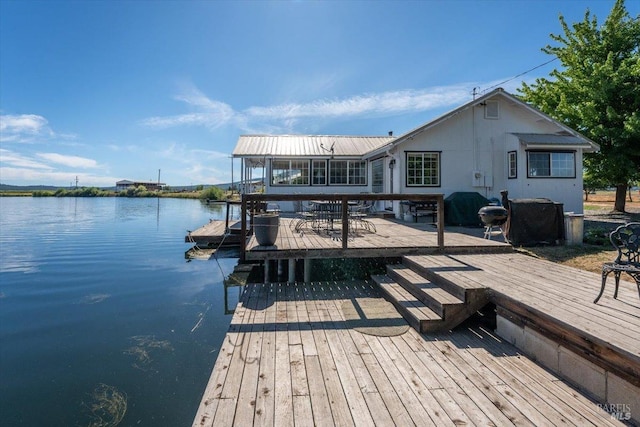 dock area featuring a water view