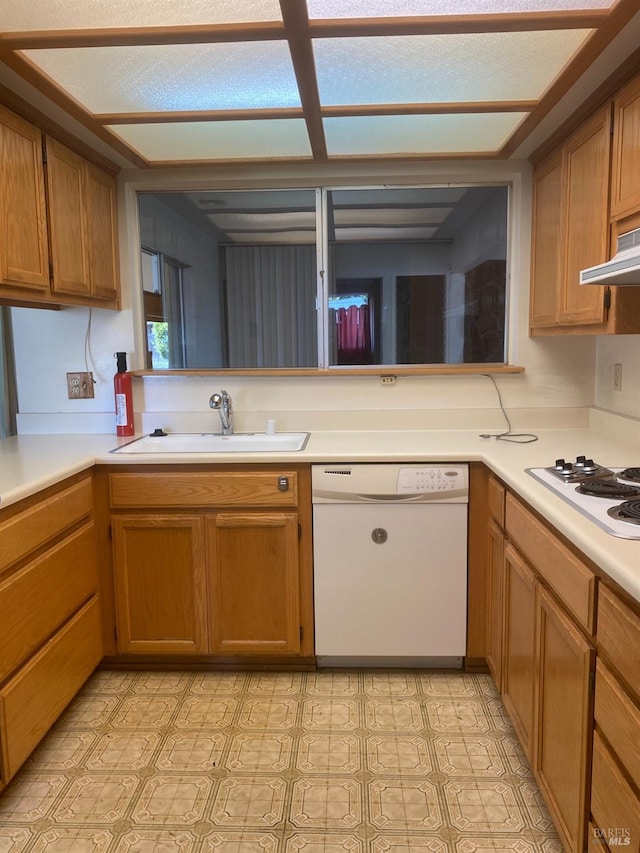 kitchen featuring white appliances and sink