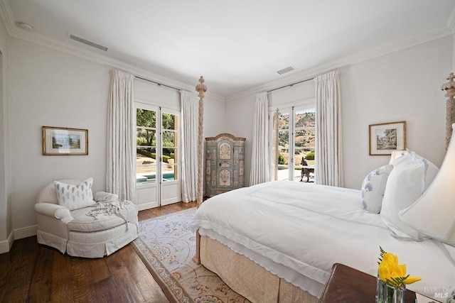 bedroom with access to outside, crown molding, and wood-type flooring