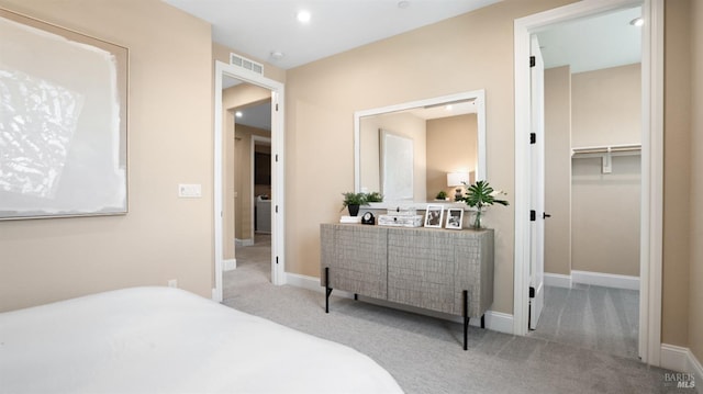 carpeted bedroom featuring a spacious closet