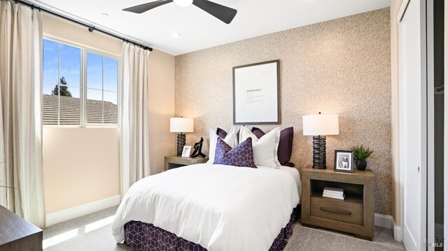 carpeted bedroom with a closet and ceiling fan