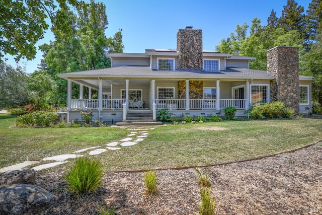 birds eye view of property featuring a rural view and a water view