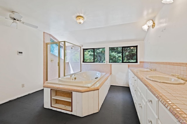 bathroom featuring double vanity, independent shower and bath, vaulted ceiling, and ceiling fan