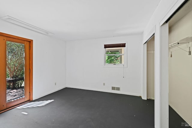 18751 Appian Way, Navarro, CA 95463 - unfurnished bedroom featuring multiple windows and concrete floors