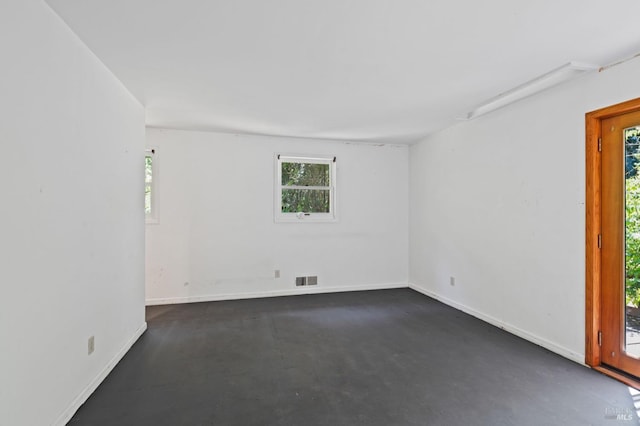 spare room featuring concrete floors