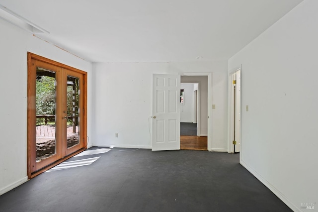 unfurnished room with french doors