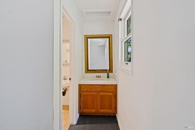 bathroom with vanity and tile patterned flooring