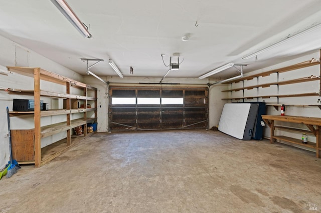 18751 Appian Way, Navarro, CA 95463 - garage with a garage door opener and fridge