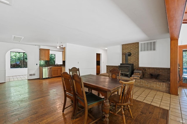 18751 Appian Way, Navarro, CA 95463 - dining room featuring a wood stove, healthy amount of natural light, and hardwood / wood-style flooring