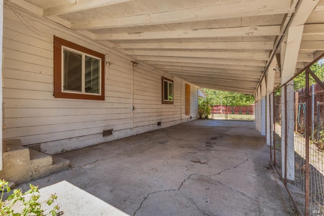 view of patio / terrace featuring a carport and fence