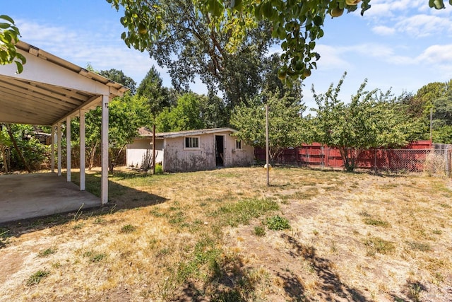 view of yard with fence and a patio area