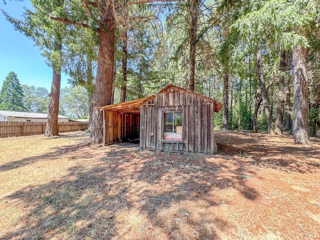 view of shed with fence