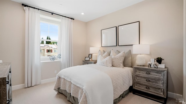 bedroom featuring light carpet