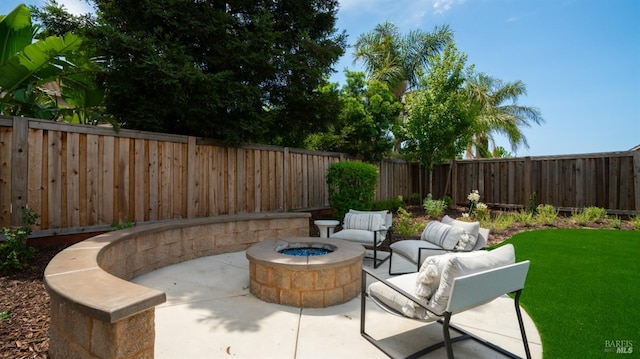 view of patio / terrace with a fire pit