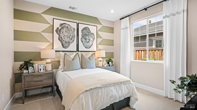 bedroom featuring light colored carpet