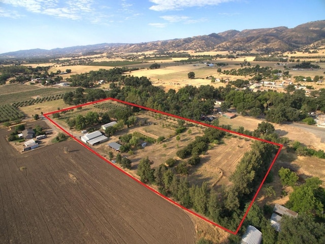 drone / aerial view featuring a rural view and a mountain view