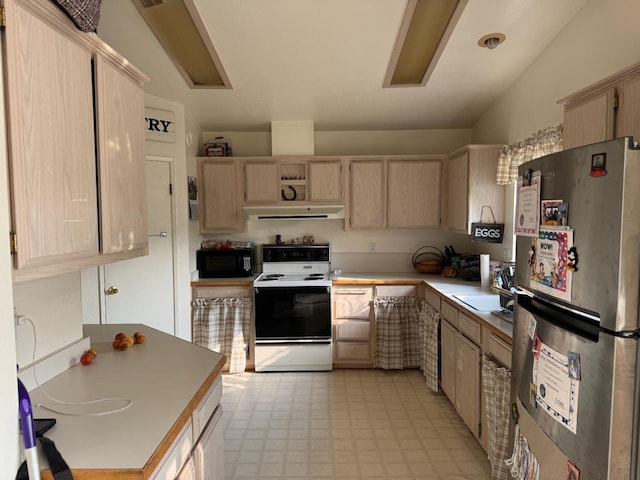 kitchen featuring lofted ceiling, sink, stainless steel fridge, white electric range oven, and light brown cabinetry