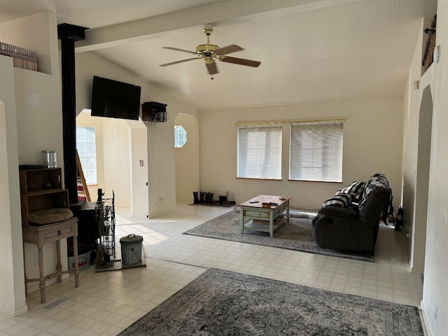 living room featuring visible vents, tile patterned floors, a ceiling fan, and lofted ceiling with beams