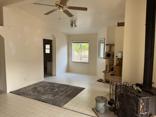 foyer with tile patterned floors and a ceiling fan