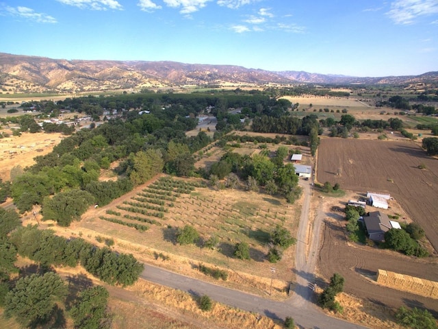 drone / aerial view featuring a mountain view and a rural view