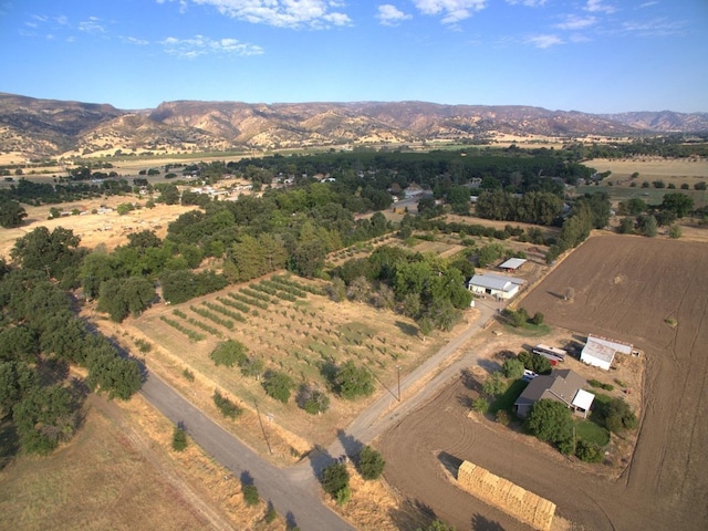 aerial view with a mountain view and a rural view